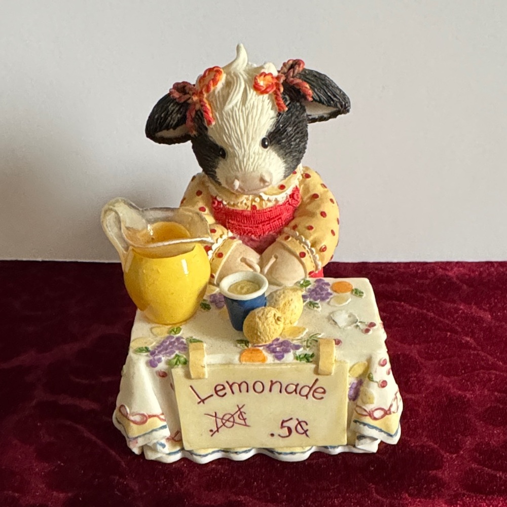 Charming Cow Figurine with Lemonade Stand